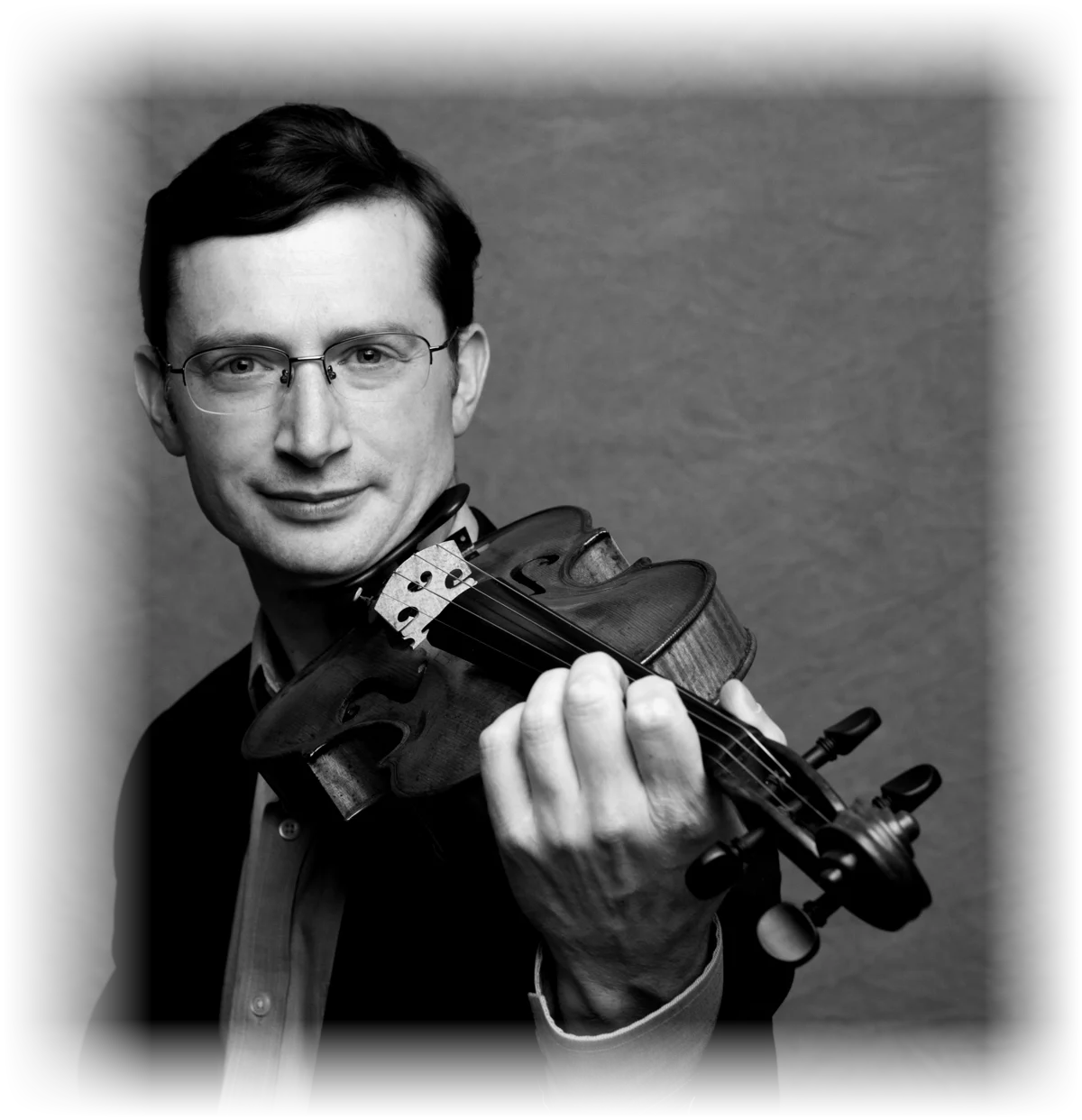 Jeremy Black holding his 1783 Carcassi violin